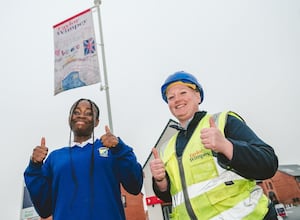 Hayford Grange Site Manager, Lauren Kelly with winner of the flag design competition, Kamsi from Ladygrove Primary School.