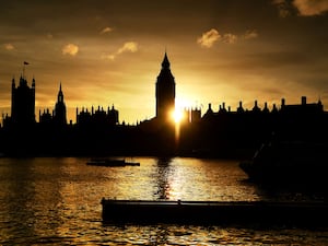 The Palace of Westminster in silhouette as the sun sets on Parliament