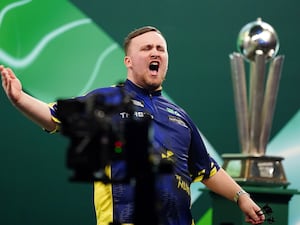 Luke Littler celebrates winning the fourth set in the World Darts Championship final