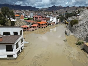 Homes are flooded by the overflowing Pasajahuira River in La Paz, Bolivia