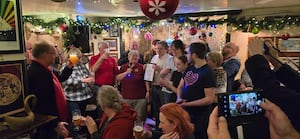 Duncan and Grace from The Bailey Head being presented with their certificate 