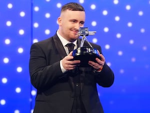 Luke Littler poses with his BBC Young Sports Personality of the Year 2024 award