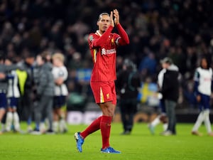 Virgil van Dijk applauds at Tottenham