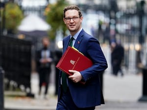 Chief Secretary to the Treasury Darren Jones arriving in Downing Street holding a red ministerial folder