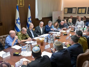 Israeli Prime Minister Benjamin Netanyahu, centre, convened his security cabinet to vote on a ceasefire deal after confirming an agreement had been reached that would pause the 15-month war with Hamas in Gaza