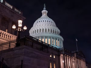 Lights are on inside the Capitol building set aside the night sky in Washington DC on Friday night