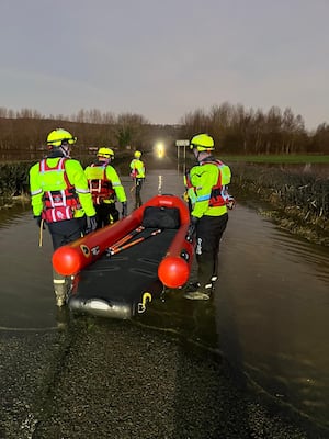 Firefighters from Montgomery at to rescue someone from a vehicle stuck in flood water near Welshpool airport. Picture: Montgomery Fire Station