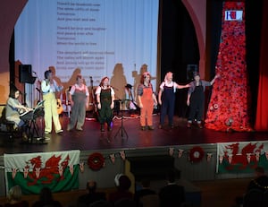 The D.Day Dames leading the audience in the singing, with Holly Richards (centre).