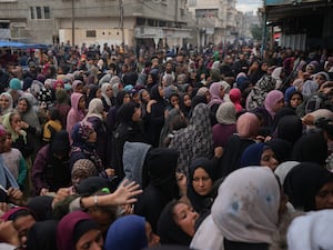 Palestinians gather for food at a distribution centre