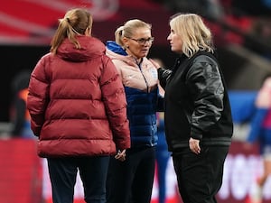 England manager Sarina Wiegman and USA manager Emma Hayes talk to each other on the touchline at Wembley