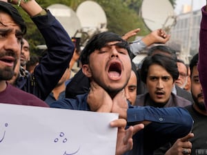 People protesting after 42 Shiite Muslims were killed by gunmen in an ambush in Kurram