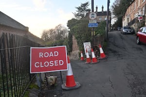 Pic in Ironbridge, Church Hill at the junction with New Road, where a vehicle has damaged an old historic wall.