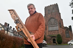 Parish administrator Steve Swinden with part of the door at Shrewsbury Abbey which was damaged in a break-in