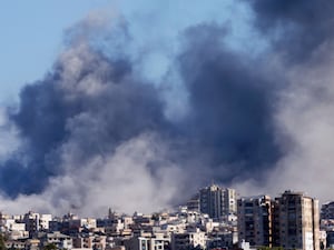 Smoke rises between buildings hit in Israeli air strikes in Tyre, south Lebanon