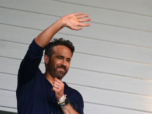 Ryan Reynolds waves to fans