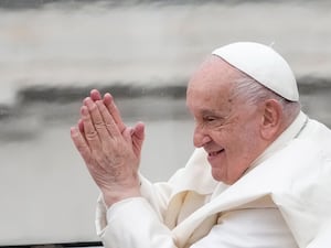 Pope Francis waves as he leaves after his weekly general audience in St Peter’s Square at The Vatican