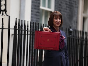 Rachel Reeves holds up the Chancellor's red box outside 11 Downing Street