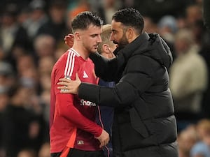 Mason Mount is consoled by United manager Ruben Amorim