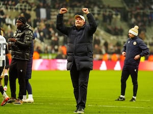 Bromley manager Andy Woodman gestures to the travelling fans at Newcastle