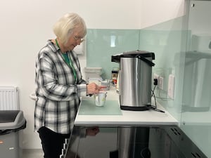 Tessa Bradley, Llandrindod Foodbank and Advice Centre Project Manager using the new kitchen to prepare hot drinks.