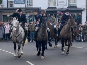 Some of the members of the hunt leaving to follow the false trail.