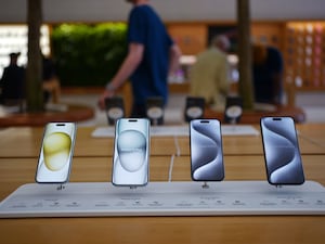 Apple iPhones on display (PA)