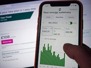 An energy bill and summary is seen on a smartphone screen