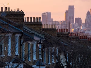 Houses feature in a city skyline