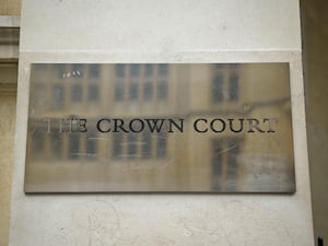 A plaque reading 'The Crown Court'