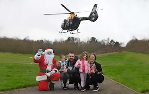 Santa with Georgie and Stefan, 2, Gergana, 4 and Steliyana Baychev, from Shrewsbury