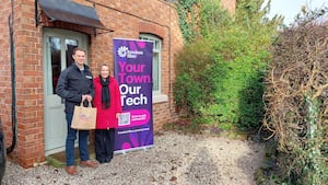 First customer Chris Beane with Helen Morgan MP.