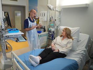 Senior clinical practice facilitator Rob McDonnell talks to patient Katie Tinkler