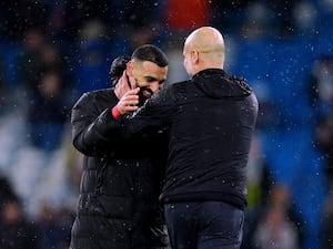 Mohamed Salah greets Pep Guardiola