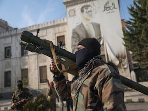 A Syrian rebel holding a rocket launcher