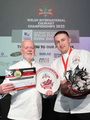 Sam Everton receives the National Chef of Wales trophy from Colin Gray, CAW chairman of judges.