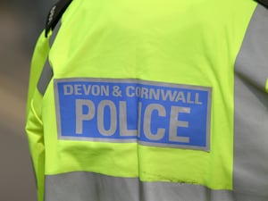 Devon and Cornwall Police officer wearing reflective yellow jacket