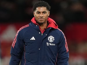 Marcus Rashford wearing a coat during the warm-up before a game