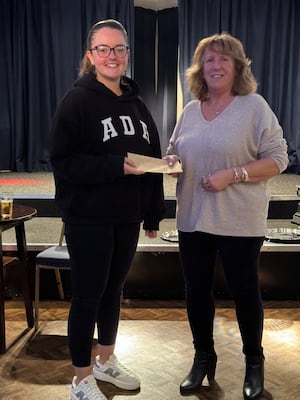 League averages winner Natalia Moseley gets her prize from Wendy Jones 