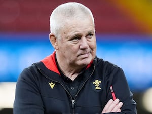 Warren Gatland folds his arms as he watches Wales train