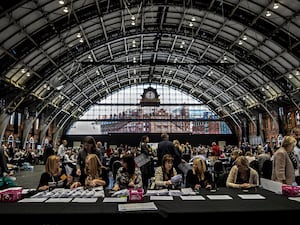 Election staff count ballot papers for the Greater Manchester mayoral election at the Manchester Central Convention Complex.