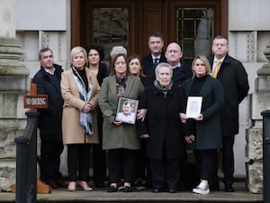 The family of murdered GAA official Sean Brown with supporters (PA)