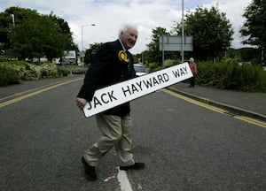 Hayward posing with his own road sign, after Wolverhampton Council decided to name a road next to Molineux after the club legend