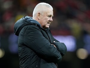 Warren Gatland, with his arms folded, looks on