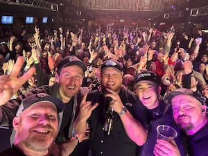 Liam Price (centre) with other band members from Wolverhampton and Telford after the gig, near Pittsburgh