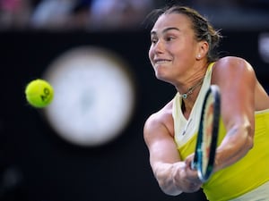 Aryna Sabalenka hits a backhand