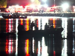 Rescuers searching the Potomac for survivors