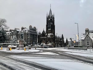 A snowy scene of Aberdeen city centre