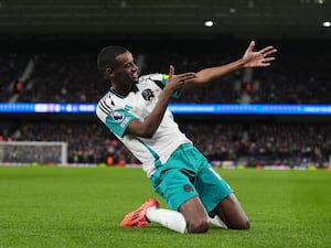 Alexander Isak celebrates by sliding on his knees