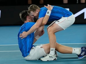 Harri Heliovaara, right, and Henry Patten celebrate their Australian Open victory