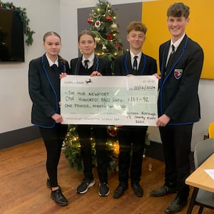 Burton Borough School students handing over cash to The Hub. In picture: Ava Summer Williams, Holly Appleby, Harvey Arnold and Max Harris.